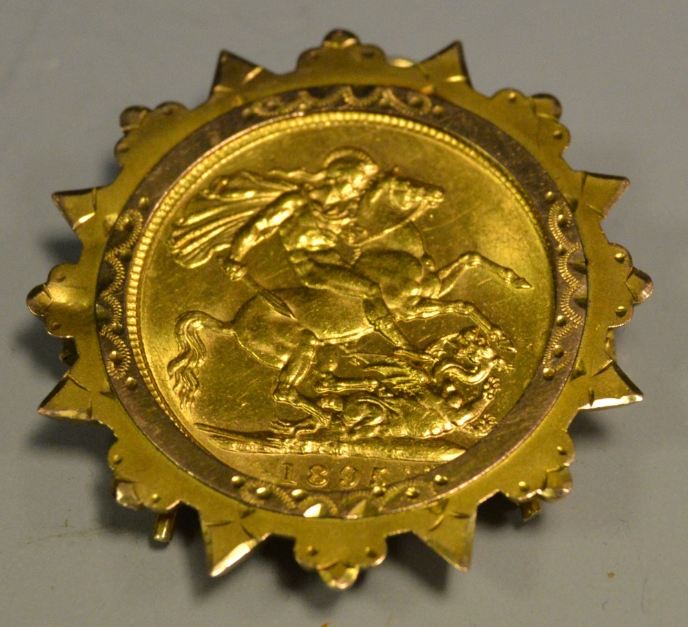 A Victorian sovereign pendant brooch 1875, 9ct goldstan burst frame 10.