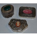 Two silver decorative pill boxes, embossed in relief,
