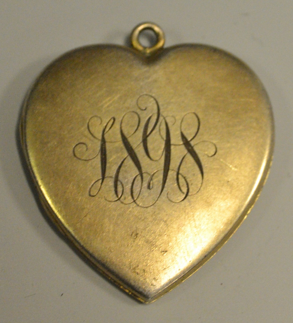 A late 19th century silver-gilt heart shaped locket pendant, marked Sterling, c.