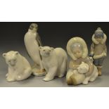 A Lladro model, of a polar bear, seated; another,