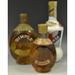 A bottle of Dimple Whiskey; a 1/2 bottle Dimple Whiskey;