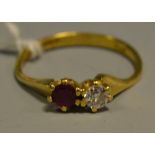 A diamond and ruby duet ring, each round cut stone approx 0.