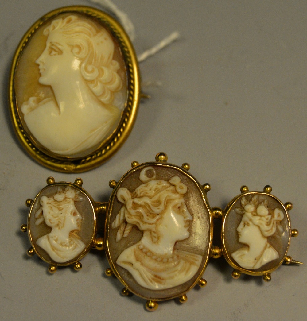 A 19th century carved shell cameo trilogy brooch,