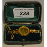 An Edward VII half sovereign brooch yellow metal mount 1910 8.