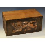 A hardwood corbel or architectural section, carved in relief with a lion passant, 27.