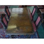 A Victorian oak wind out dining table; additional leaf; a set of four oak dining chairs,