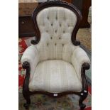 A reproduction Victorian style spoonback armchair,