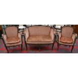 A Louis XV Revival walnut salon suite, comprising a small sofa and a pair of armchairs,