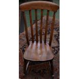 A Victorian beech comb-back kitchen rocking chair, c.