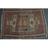 A hand knotted Middle Eastern rug, 193cm x 132cm,