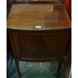 An Edwardian bow fronted cabinet, outlined with boxwood stringing, square tapered legs, 80cm high,