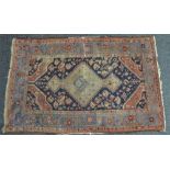 A hand knotted Middle Eastern Rug, 194cm x 120cm,