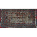 A hand knotted Middle Eastern rug, 195cm x 105cm,