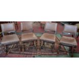 A set of four oak dining chairs, leather back and seats, c.
