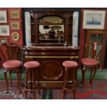 A mahogany bar and mirror back display cabinet, brass foot and arm rails,