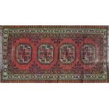 A hand knotted Middle Eastern rug, 150cm x 80cm,