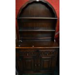 An oak Priory style dome top dresser