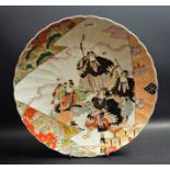 A Japanese shaped circular charger, painted in polychrome enamels with Samurai, 36.