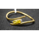 A 9ct gold yellow stone twisting hinge bangle, 12.