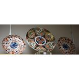 A pair of early 20th century Japanese Imari pattern shaped circular plates,