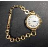 A ladies vintage 1940's 9ct gold bracelet watch, silvered dial, Arabic numerals, minute track,