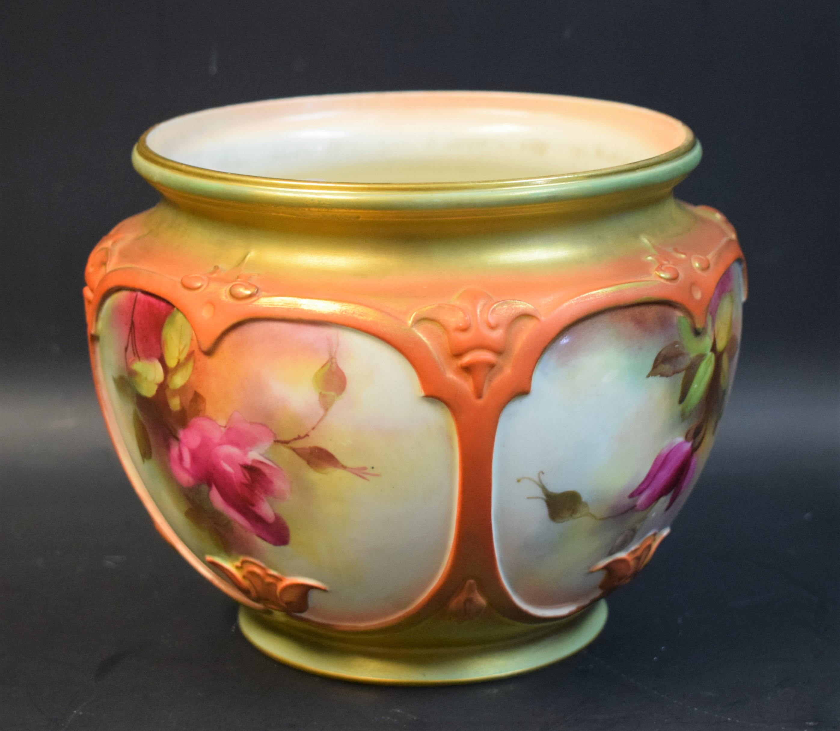 A Royal Worcester jardiniere, painted by Reginald Austin, signed, pink roses in panels,