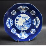 A Bow octagonal plate, the field with circular cartouche with hut, Willow, sampan and rock,