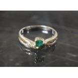 An emerald and diamond ring,