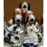 Ceramics - a pair of 19th century Staffordshire fireside dogs, russet painted; another similar pair,