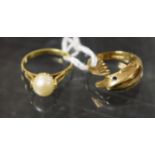 A 14ct gold ring, set with a single pearl, 1.8g; a 9ct gold dolphin ring, 2.