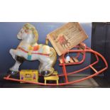 A Pelham puppet, Poodle, boxed; a Chad Valley type rocking horse; a book,