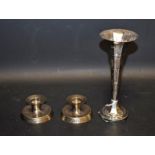 A pair of candlesticks, compressed form, PVM London 1986; a silver trumpet bud vase,