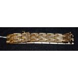 A 14ct gold articulated double row textured link bracelet, 22.