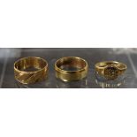 Rings - a 9ct gold textured band ring; another; a 9ct gold signet ring, 9.