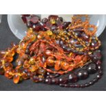 Costume Jewellery - a cherry amber coloured faceted graduated bead necklace; others, freeform,