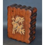 A Japanese hardwood shaped rectangular box, the push-fitting cover applied with leafy bamboo, 12.