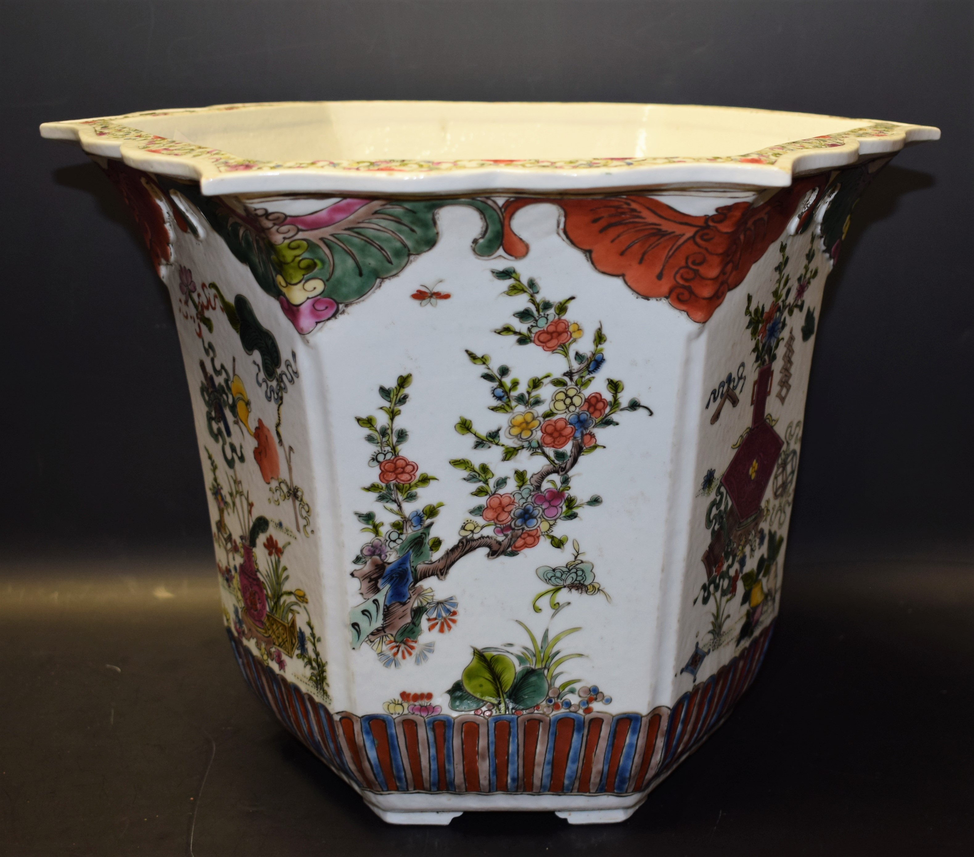 A Chinese hexagonal jardiniere, brightly painted in polychrome enamels with flowering branches,