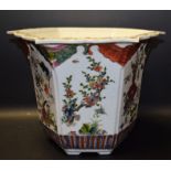 A Chinese hexagonal jardiniere, brightly painted in polychrome enamels with flowering branches,