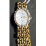 A 9ct gold lady's sovereign wristwatch, mother of pearl dial, diamond set bezel, 16.