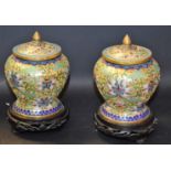 A pair of Japanese cloisonne vases and covers,