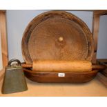 A 19th century wooden trencher, 60cm long; a brass cow bell, James Barwell,