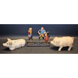 Two cast iron pig money banks;