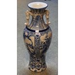 A large Japanese blue and white floor vase, decorated in blue with stylised flowers and scrolls,