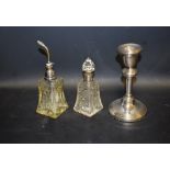 A silver dressing table candlestick, Birmingham 1918; a cut glass scent atomiser,