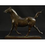 A mid 20th century bronze trotting horse, tail erect,