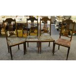 A set of four Art Nouveau oak dining chairs, cresting carved top rail, pierced splat,