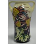 A contemporary Moorcroft Trial two handled waisted vase, tube lined with flowers and foliage,