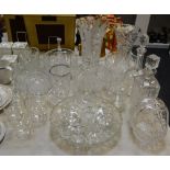 A large quantity of cut glass including bowls, vases, ice bucket, flower basket, decanters,