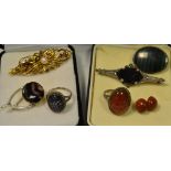 A 9ct gold seed pearl and garnet pin brooch; another set with rubies and central pearl,