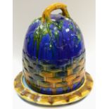A Majolica beehive cheese dome and stand,